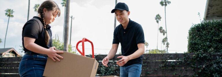 Delivery person getting parcel out for delivery